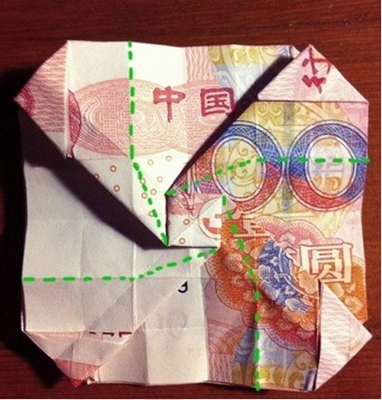 用一百元折玫瑰花怎么折，求图解