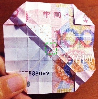 用一百元折玫瑰花怎么折，求图解